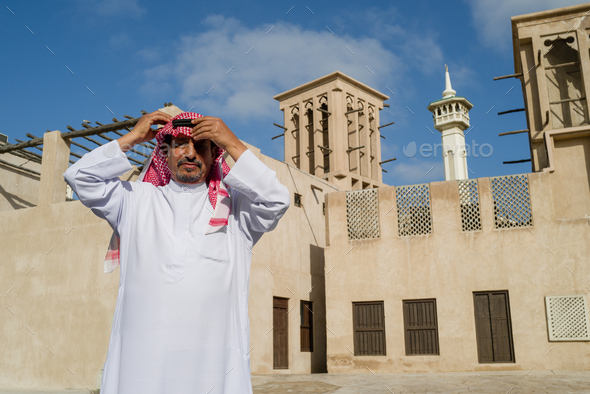 Portrait of mature Arab man standing in the old town - Stock Photo - Images