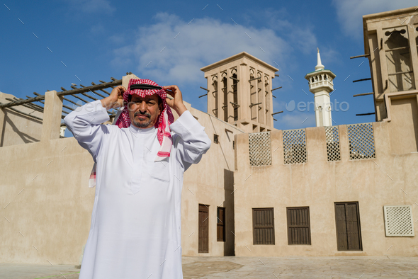 Portrait of mature Arab man standing in the old town - Stock Photo - Images