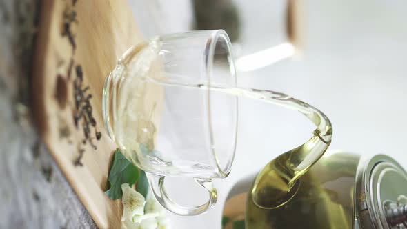 Morning Tea Time. Green Tea Glows In Sun. Dry Green Tea Granules In The Foreground. Herbal Tea alt