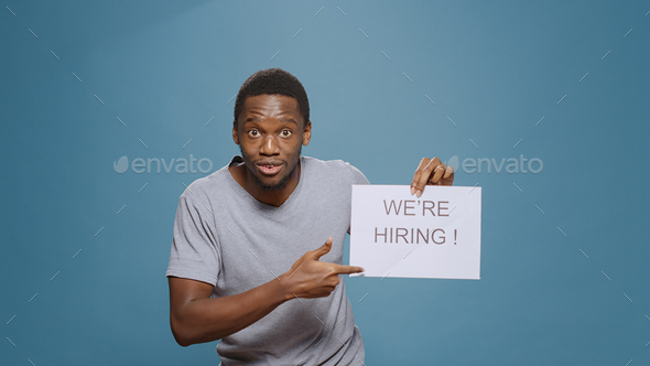 Company employee showing hiring application sign on paper