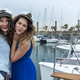 model women standing and posing on a sailboat while kissing to camera - PhotoDune Item for Sale