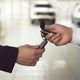 Car salesman gives the keys to the customers who signed the purchase contract - PhotoDune Item for Sale