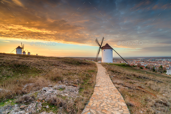 Beautiful sunrise over the Manchegos windmills - Stock Photo - Images