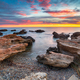Stunning sunrise over the beach and rocks at Torre de la Sal - PhotoDune Item for Sale