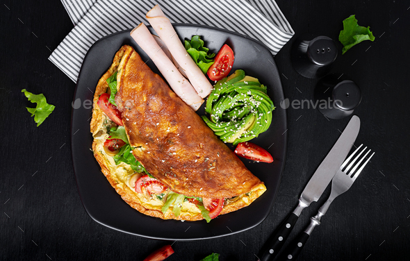 Keto Breakfast. Omelette Tomato, Olives And Avocado, Ham. Stock Photo ...