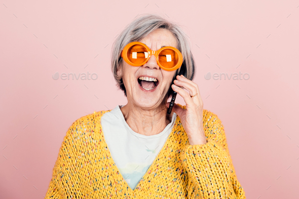 Portrait of an old smiling grandmother wearing sunglasses. The youth of the  soul. Generative AI 22807977 Stock Photo at Vecteezy