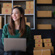 Portrait of Asian young woman SME working with a box at home. small business owner entrepreneur SME - PhotoDune Item for Sale