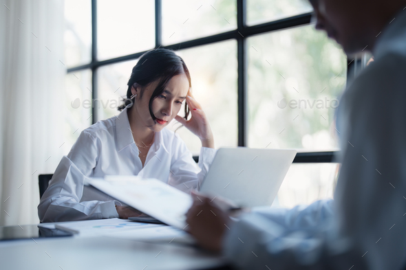 Stressed overwhelmed business person feels tired at corporate meeting, stress at work or migraine - Stock Photo - Images