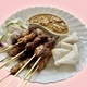 A plate of chicken, beef and mutton satay served with nasi impit and peanut sauce - PhotoDune Item for Sale