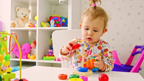 The Child Plays with Toys in the Room alt