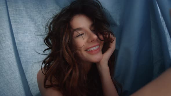 Hot Girl Taking Selfie Cellphone Under Sheet. Funny Woman Looking Phone Camera alt