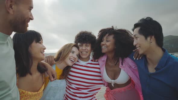 Group of friends having fun on the beach. alt
