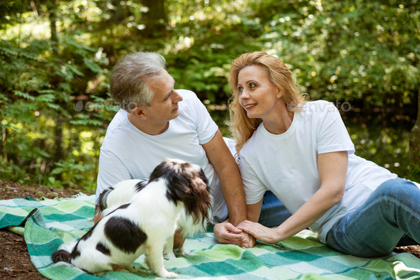 Senior couple on a picnic in the woods