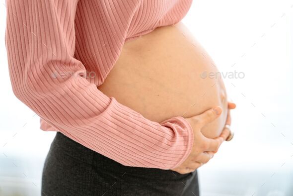 Pregnant Woman Standing And Touching With Her Hands Her Big Naked Belly A Hypnobirthing