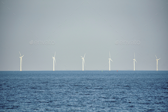 Scenic view of the offshore wind turbines in the middle of the sea