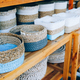 different handmade weaving baskets in craft shop in a row. - PhotoDune Item for Sale