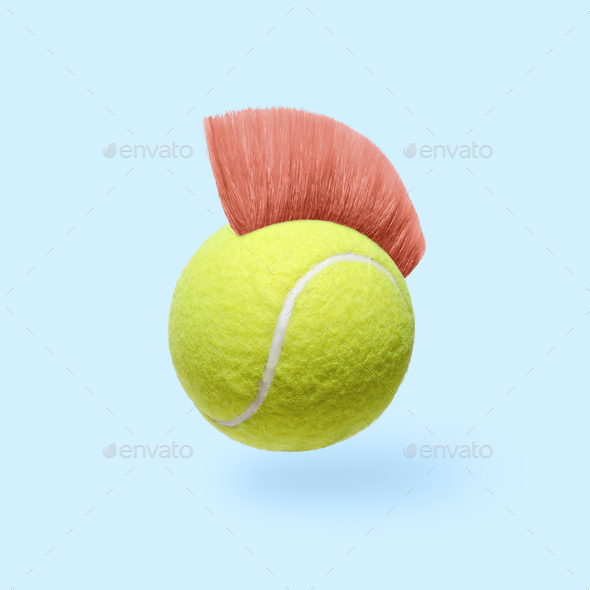 Humor pop art fun tennis ball with a pink mohawk hairstyle. - Stock Photo - Images