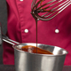 Frozen motion. Handmade dessert. Pastry chef testing melting chocolate with a whisk. Hot chocolate - PhotoDune Item for Sale