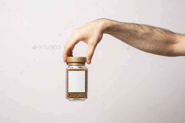 Instant coffee in a glass jar with blank label isolated on white