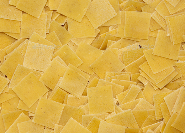 Closeup of raw square-shaped pasta quadretti in a bowl - Stock Photo - Images