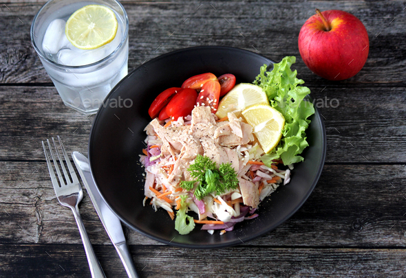 Tuna salad, apple and water for a healthy lunch - Stock Photo - Images