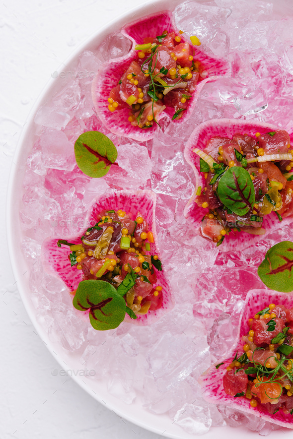tuna tartare tartlets on ice cubes Stock Photo by AntAlexStudio PhotoDune