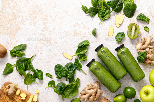 Smoothie. Healthy fresh raw detox spinach smoothie with green apple, kiwi and ginger in a bottles - Stock Photo - Images