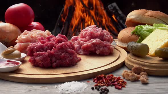 Ingredients for Homemade Burger Preparation Raw Minced Meat on the Wooden Board alt