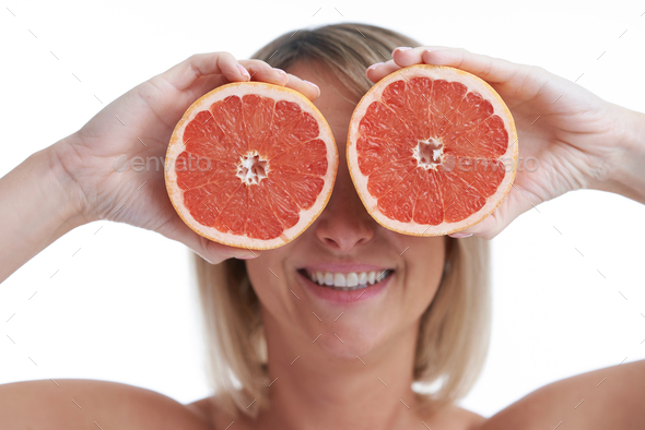Picture of nice blonde woman with grapefruit - Stock Photo - Images