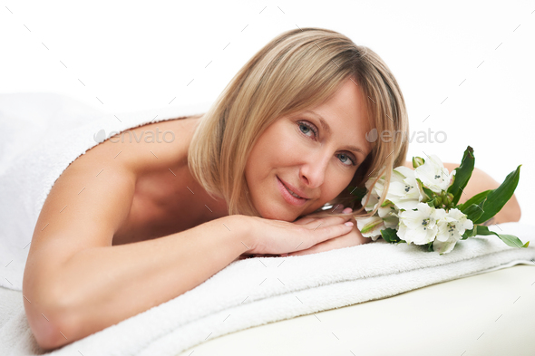 Picture of nice blonde woman with flower - Stock Photo - Images