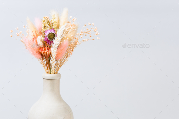 dried flowers and spikelets in ceramic bottle - Stock Photo - Images