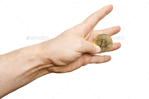 white background the hand of a man between the fingers of which there is a Bitcoin coin