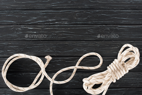 Top View Tied Nautical Rope Grunge Wooden Surface Stock Photo by