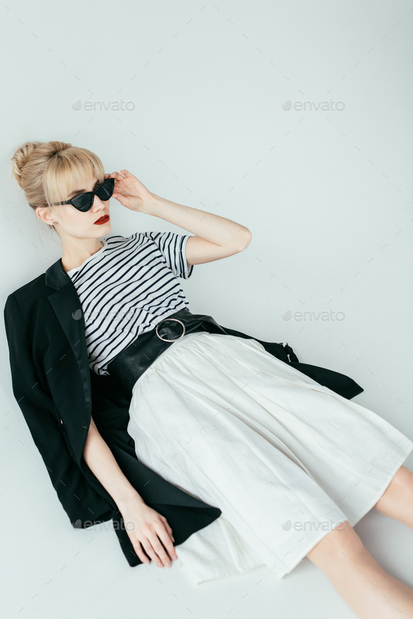 Fashionable blonde girl wearing black and white clothes Stock Photo by ...