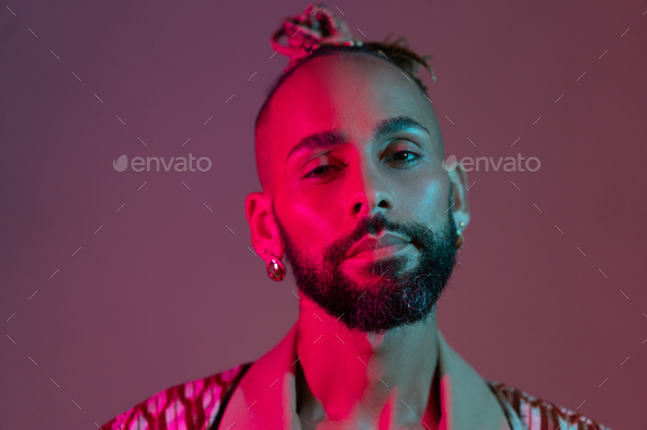 Black man in neon studio light