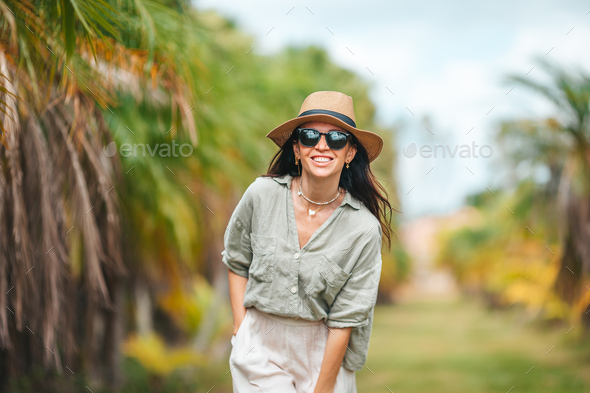 Portrait of happy young woman outdoor in the park  - Stock Photo - Images