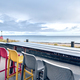 Multi-colored chairs on the terrace of a cafe by the sea. - PhotoDune Item for Sale