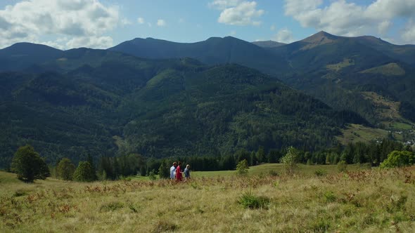 Children Parents Against Hills Walking Together Admiring Beautiful Landscape alt