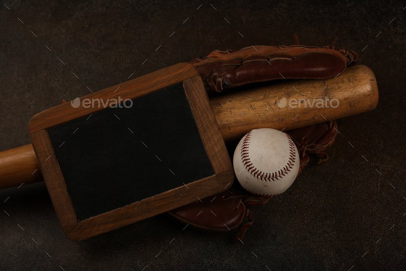 Baseball ball, wooden bat and vintage glove