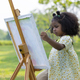Cute little girl painting at the park  - PhotoDune Item for Sale