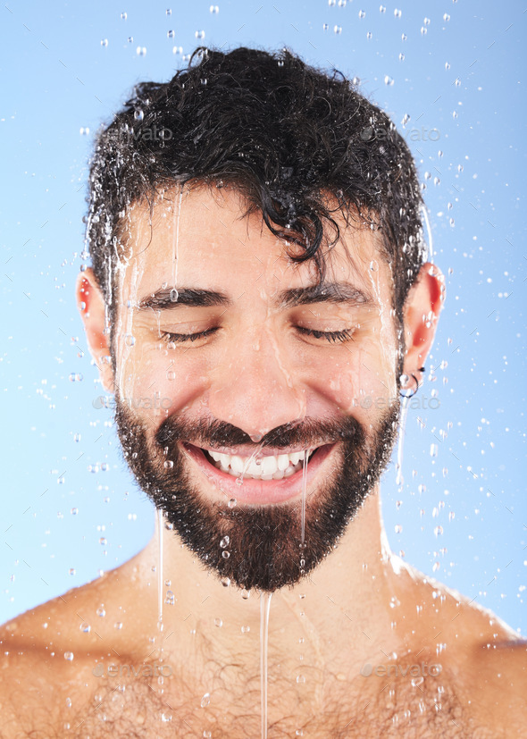 Man, shower water and smile of a model for beauty cleaning, skincare and hygiene wellness