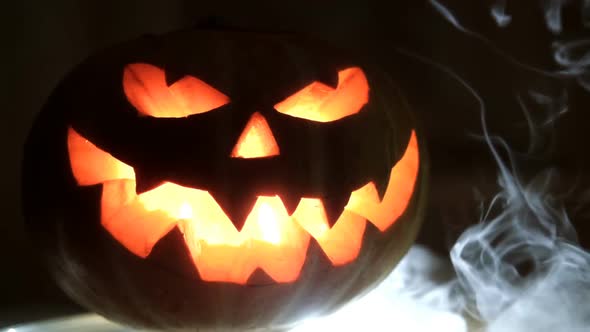 Halloween Pumpkin with Scary Face. Slow Motion.