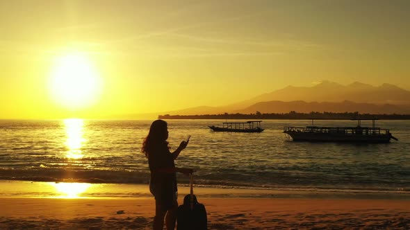 Girl sunbathing on beautiful shore beach voyage by turquoise lagoon with clean sandy background of t alt