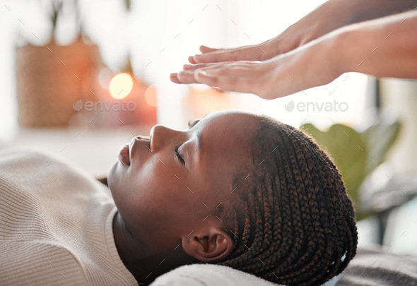 Relax, reiki and black woman with lying at spa for spiritual chakra therapy and alternative medicin