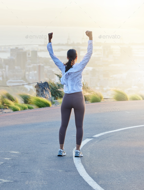 Run celebration, woman winner and fitness goal of a excited and happy runner on a road. Cityscape,
