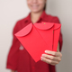 Woman holding Chinese red envelope - PhotoDune Item for Sale