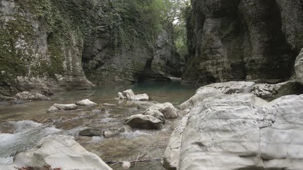 Aerial view of Martvili canyon. Blue water in fresh cold mountain river at sunny summer morning alt