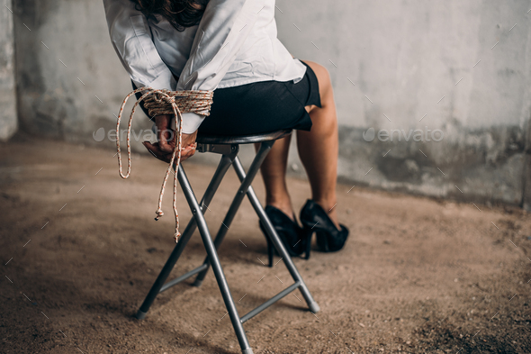 woman hands bound. Women were handcuffed and Sitting on a chair.woman ...