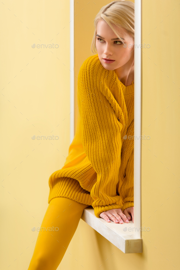 Stylish Pensive Woman Yellow Sweater Tights Sitting Decorative Window Stock  Photo by ©VitalikRadko 195385642