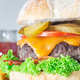 Huge giant homemade cheeseburger for burger party, closeup vertical - PhotoDune Item for Sale